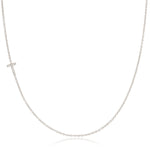 A white gold necklace with a letter T pave charm on a white background.