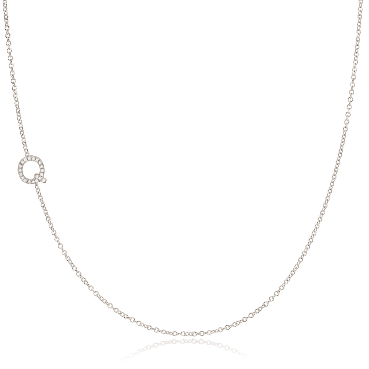 A white gold necklace with a letter Q pave charm on a white background.