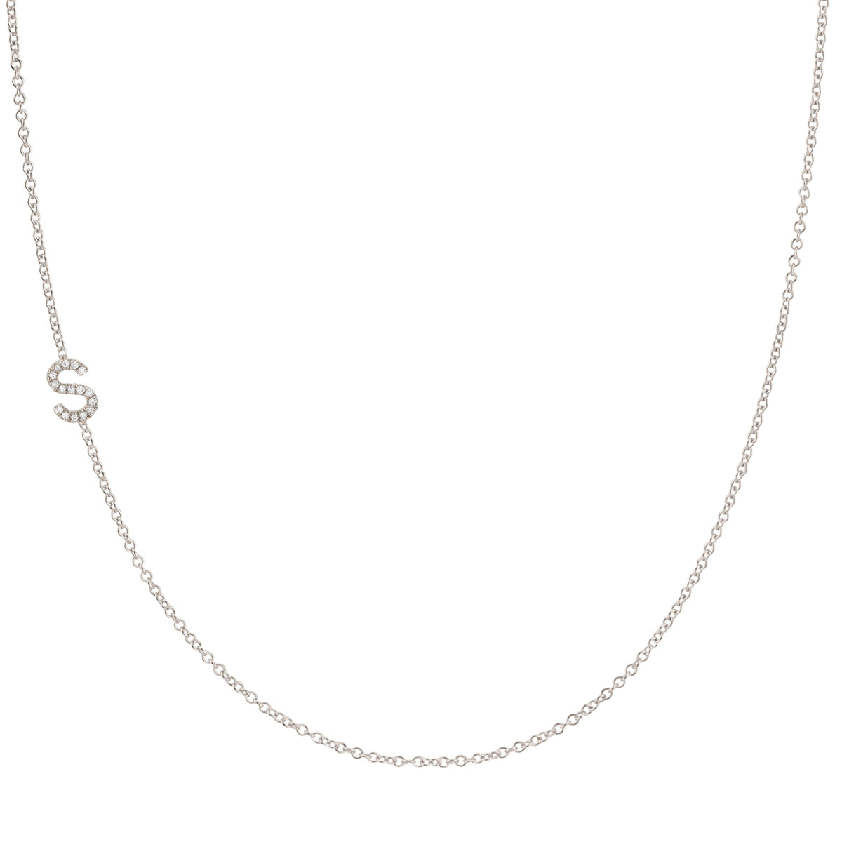 A white gold necklace with a letter S pave charm on a white background.