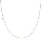 A white gold necklace with a Y letter charm on a white background. 