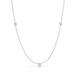 Triple Diamond Layering Necklace in white gold on a white background. 