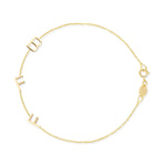 A yellow gold Custom Gold Bracelet - 3 Letters (B, F and F) on a white background. 