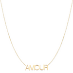 An AMOUR Necklace in yellow gold on a cable chain on a white background. 