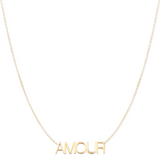 An AMOUR Necklace in yellow gold on a cable chain on a white background. 