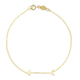 A Straight as an Arrow Bracelet in yellow gold on a white background. 