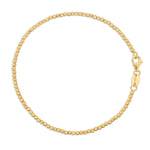 A Diamond Cut Bracelet in yellow gold on a white background. 