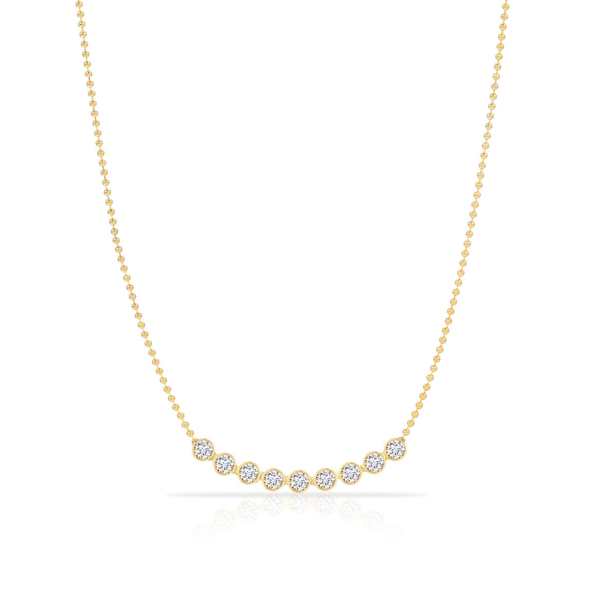 A Diamond Arc Layering Necklace in yellow gold on a white background. 