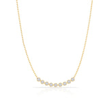 A Diamond Arc Layering Necklace in yellow gold on a white background. 