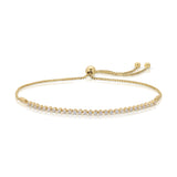 A Tie-Breaker Bracelet in yellow gold on a white background. 