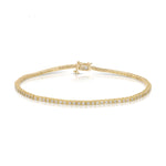 A Down the Line Bracelet in yellow gold on a white background. 