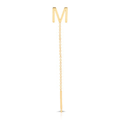 A yellow gold threader earring with a letter M stud on a white background.