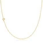A yellow gold necklace with a pave letter P charm on a white background. 
