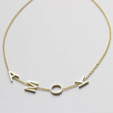 A yellow gold Custom Gold Bracelet – 4 Letters with the letters A, M, O and K on a white background.