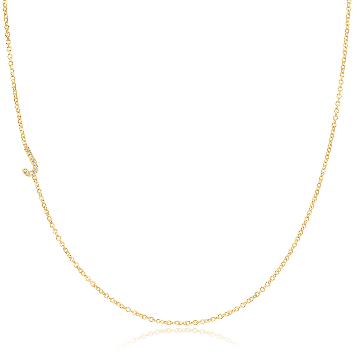 A yellow gold necklace with a pave letter J charm on a white background. 