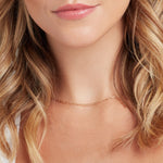 Close-up of a blonde woman's neck wearing an Element Short Link Chain. 