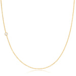 A yellow gold 14K Gold Asymmetrical Birthstone Necklace - Pearl (June) on a white background. 