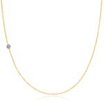 A yellow gold 14K Gold Asymmetrical Birthstone Necklace - Tanzanite (December) on a white background. 