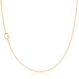 A yellow gold necklace with a G letter charm on a white background. 