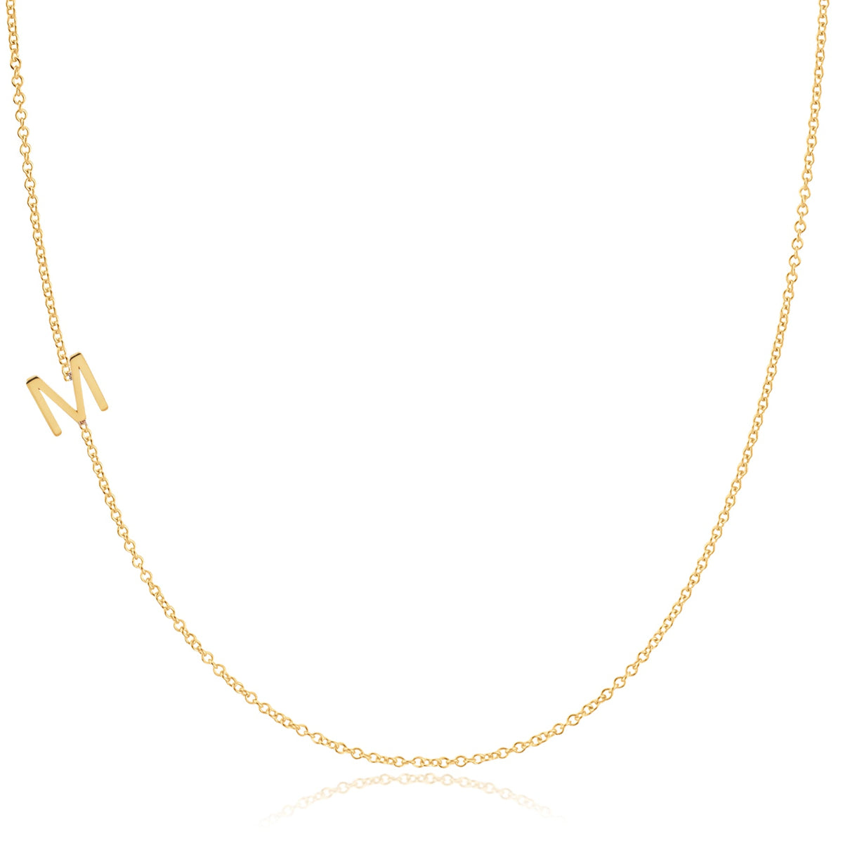 A yellow gold necklace with an M letter charm on a white background. 