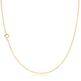 A yellow gold necklace with a P letter charm on a white background. 