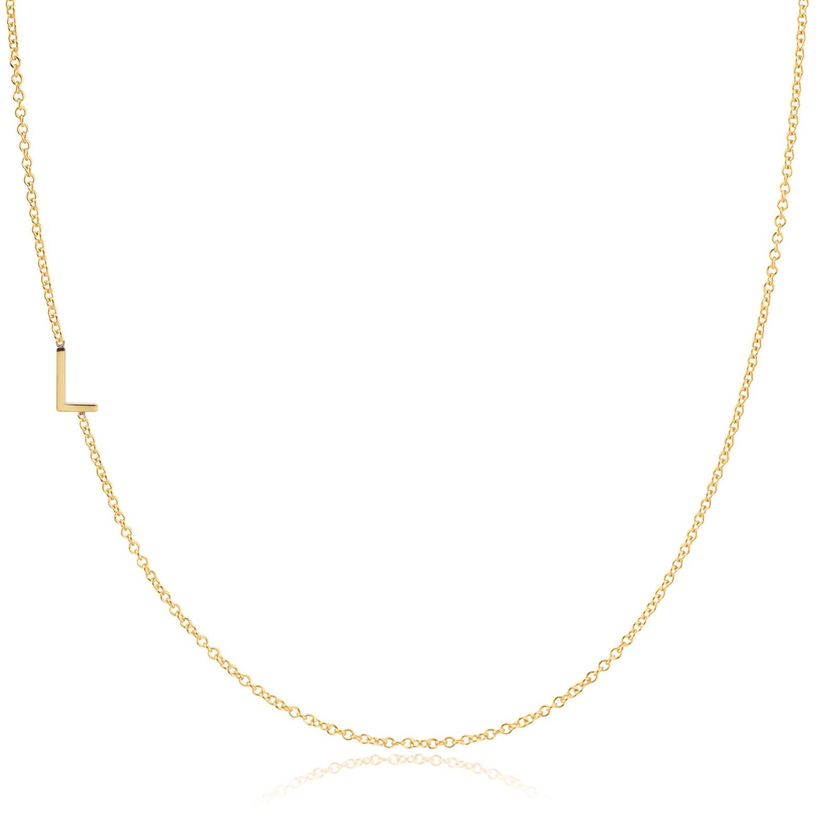 A yellow gold necklace with a L letter charm on a white background. 