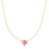 The Sweetheart Necklace - Pink Sapphire in yellow gold on a white background. 