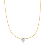The Sweetheart Necklace - White Sapphire in yellow gold on a white background. 