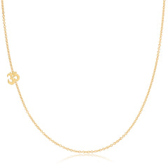 A yellow gold 14k Gold Asymmetrical Charm Necklace - Om with a cable chain on a white background. 