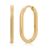 A pair of Oval Hoops in yellow gold on a white background. 