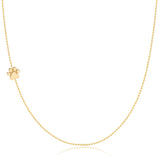 A yellow gold 14k Gold Asymmetrical Charm Necklace - Paw with a bead chain on a white background. 