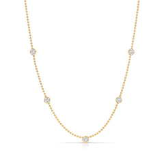 Quintet Diamond Layering Necklace in yellow gold on a white background. 