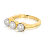 A Tres Pearl Ring on a white background. 