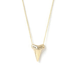 A Sharktooth Necklace with Diamond Ridge in yellow gold on a white background. 