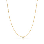 A Single Diamond Layering Necklace in yellow gold on a white background. 