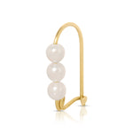 A Tres Pearl Earring on a white background. 