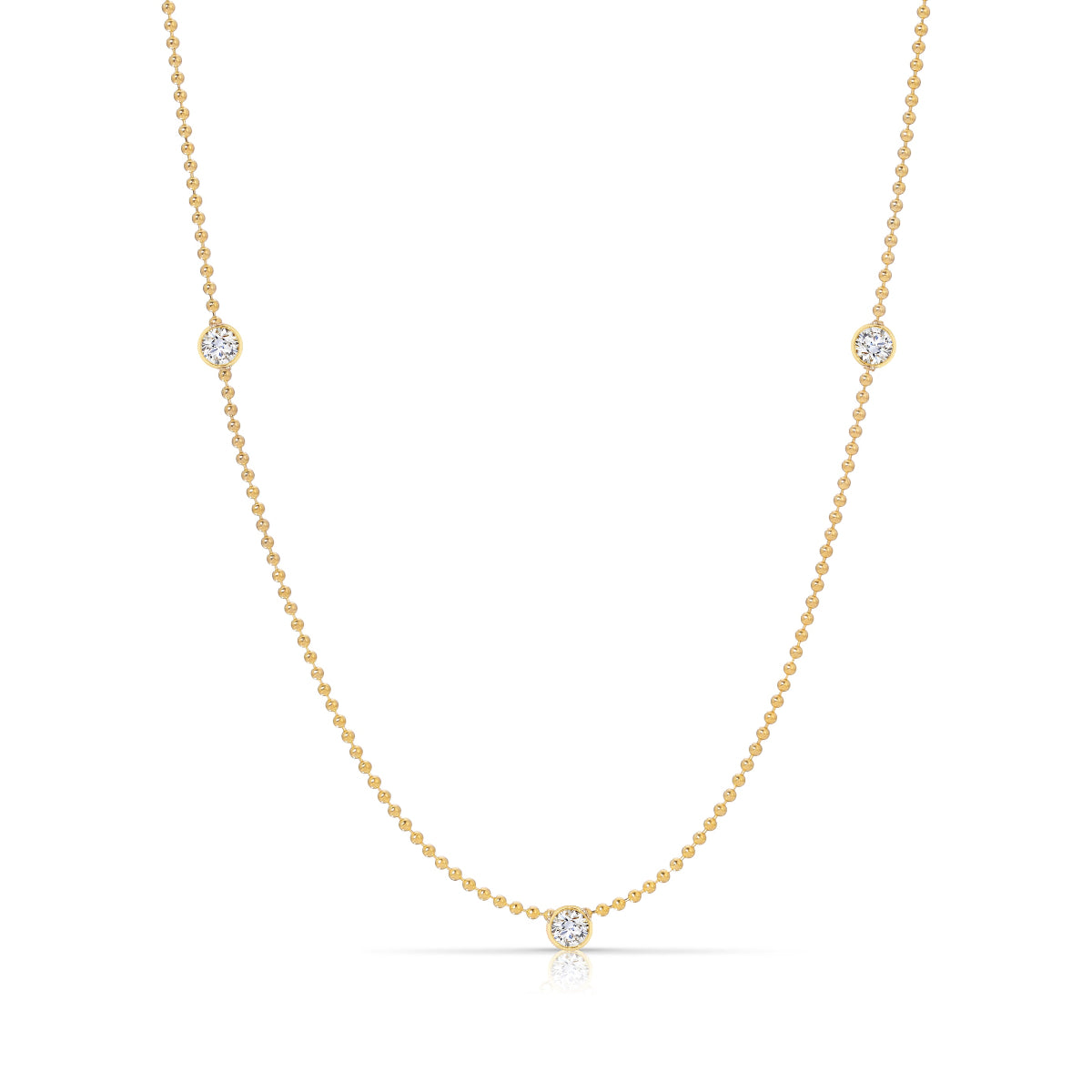 Triple Diamond Layering Necklace in yellow gold on a white background. 