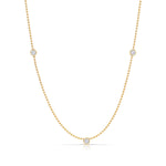 Triple Diamond Layering Necklace in yellow gold on a white background. 