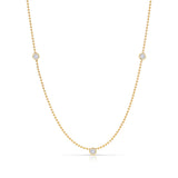 Triple Diamond Layering Necklace in yellow gold on a white background. 