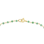 The clasp closure of the Clover Bouquet Necklace on a white background. 