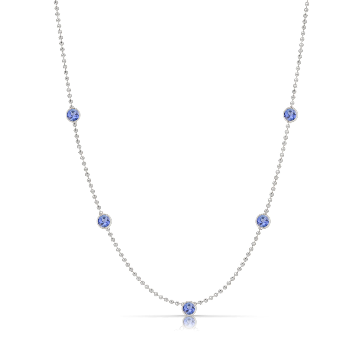 A Quintet Birthstone Layering Necklace – White Gold in Tanzanite – December on a white background.