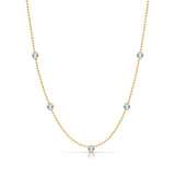 A Quintet Birthstone Layering Necklace - Yellow Gold in Aquamarine - March on a white background.