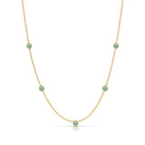 A Quintet Birthstone Layering Necklace - Yellow Gold in Emerald - May on a white background.