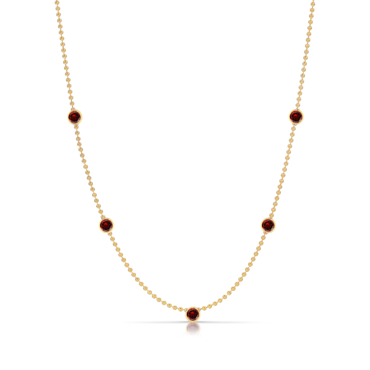 A Quintet Birthstone Layering Necklace - Yellow Gold in Garnet - January on a white background.