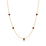 A Quintet Birthstone Layering Necklace - Yellow Gold in Garnet - January on a white background.