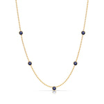 A Quintet Birthstone Layering Necklace - Yellow Gold in Sapphire - September on a white background.