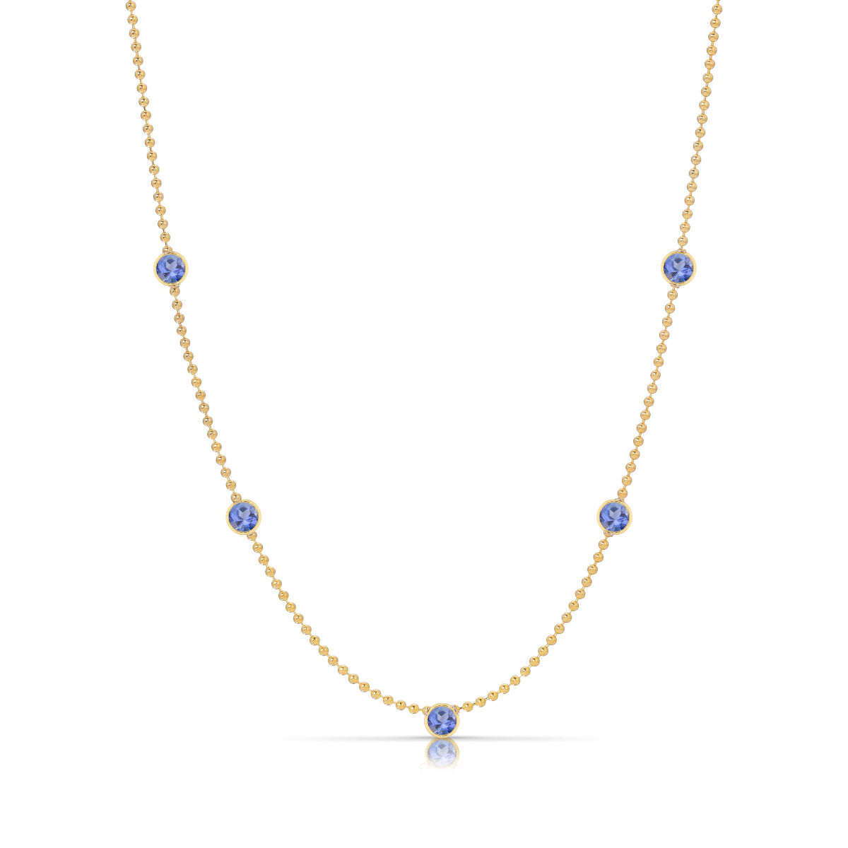 A Quintet Birthstone Layering Necklace - Yellow Gold in Tanzanite - December on a white background.