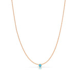 A Single Birthstone Layering Necklace - Rose Gold in Turquoise on a white background. 