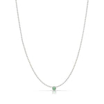 A Single Birthstone Layering Necklace - White Gold in Emerald on a white background.