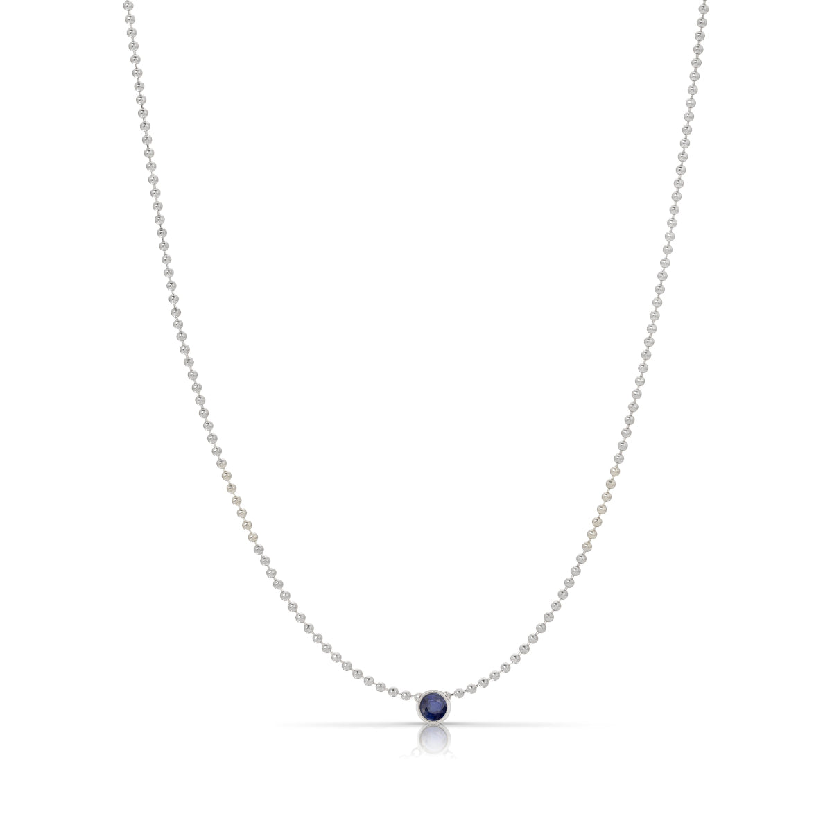 A Single Birthstone Layering Necklace - White Gold in Sapphire on a white background.