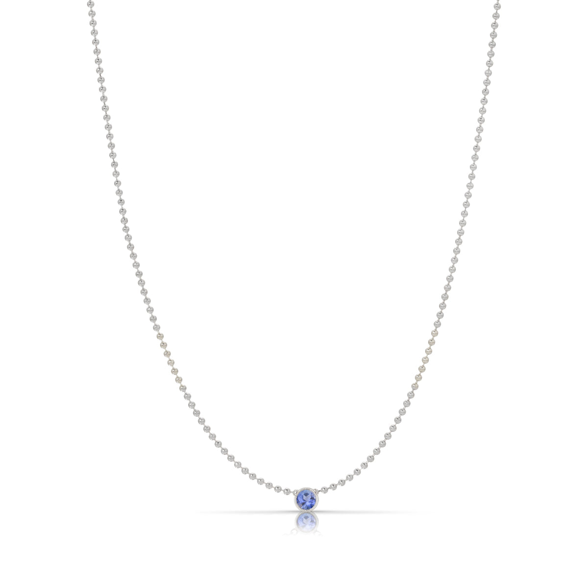 A Single Birthstone Layering Necklace - White Gold in Tanzanite on a white background.